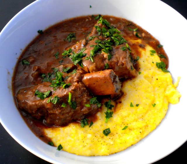 Beef Short Ribs  Braised in Red Wine with Porcini served over Soft Polenta 